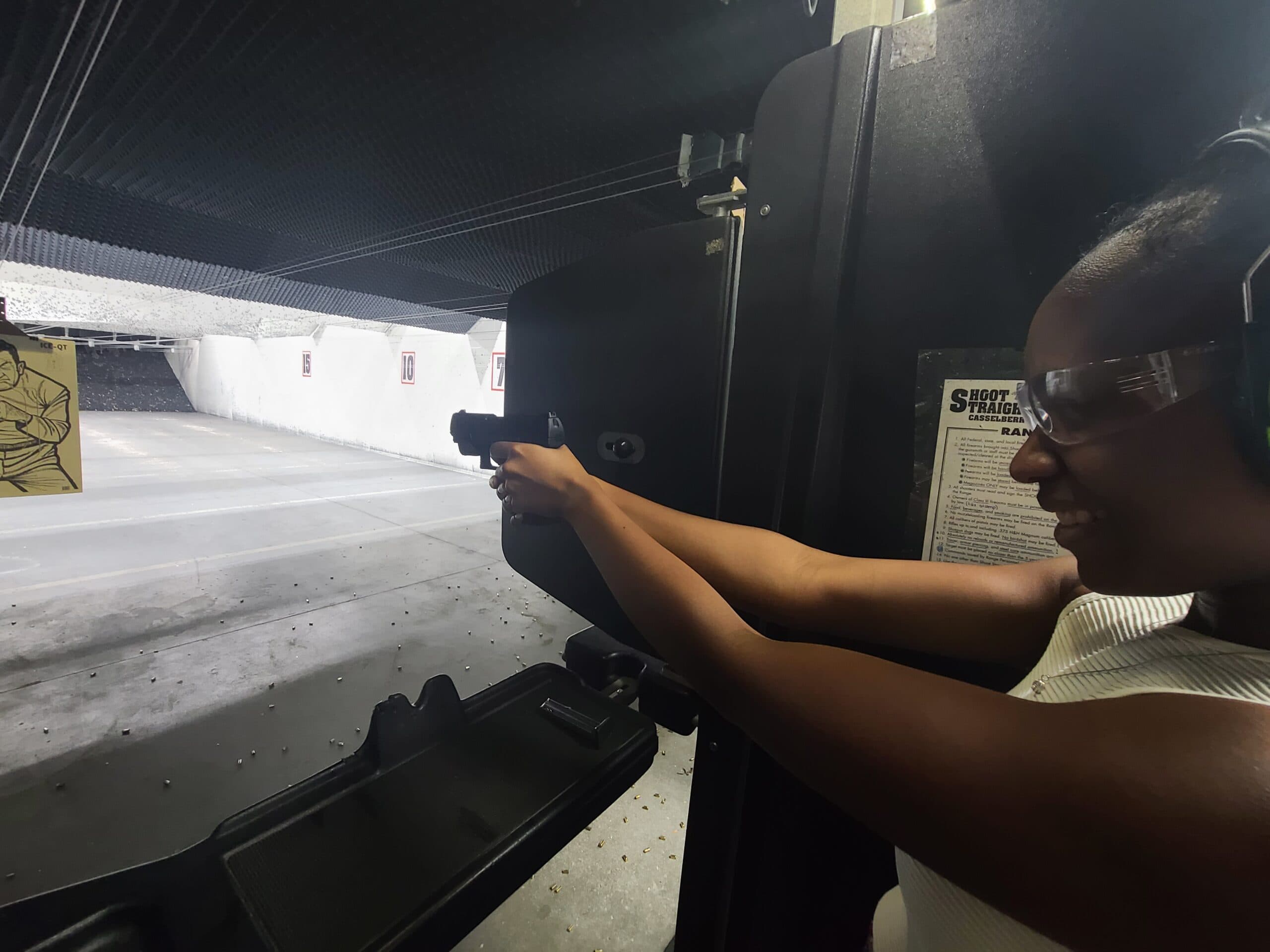 An NSC student practicing a two-handed pistol grip on the firing line during the concealed carry course
